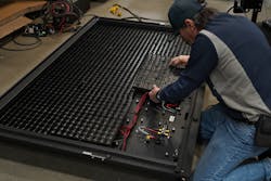 Kevin Schuessler, a technician with Command Light, builds one of digital message boards for the Carlock Fire Department.