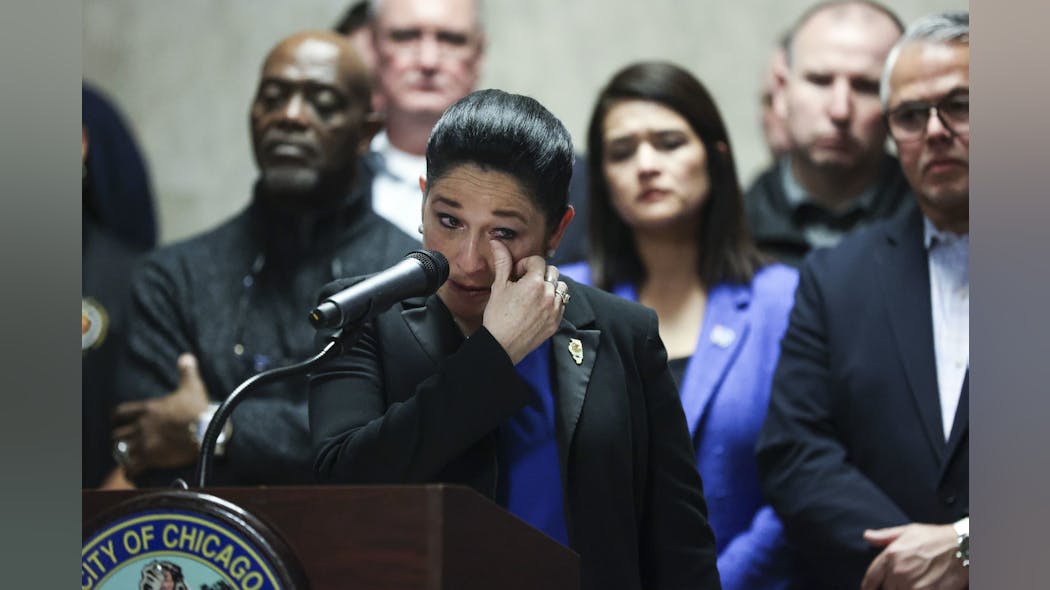 IL Comptroller Susana Mendoza wipes a tear while speaking on behalf of her brother, police Sgt. Joaquin Mendoza, during a news conference at Chicago's City Hall on Feb. 21, 2023. IL Comptroller Susana Mendoza wipes a tear while speaking on behalf of her brother, police Sgt. Joaquin Mendoza, during a news conference at Chicago's City Hall on Feb. 21, 2023.