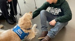 People who have experienced a traumatic event are more apt to talk to a comfort dog than to a person. Here, “Anna,” from the Lutheran Church Charities K-9 Comfort Dogs Ministry, visits with a student after the mass shooting that took place on campus on Feb. 13, 2023. People who have experienced a traumatic event are more apt to talk to a comfort dog than to a person. Here, “Anna,” from the Lutheran Church Charities K-9 Comfort Dogs Ministry, visits with a student after the mass shooting that took place on campus on Feb. 13, 2023.