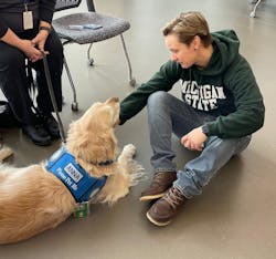 People who have experienced a traumatic event are more apt to talk to a comfort dog than to a person. Here, “Anna,” from the Lutheran Church Charities K-9 Comfort Dogs Ministry, visits with a student after the mass shooting that took place on campus on Feb. 13, 2023. People who have experienced a traumatic event are more apt to talk to a comfort dog than to a person. Here, “Anna,” from the Lutheran Church Charities K-9 Comfort Dogs Ministry, visits with a student after the mass shooting that took place on campus on Feb. 13, 2023.