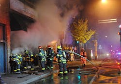 Basement fires in commercial buildings can present the same challenges to firefighters as those that members encounter at residential basement fires. At this basement fire at a one-story commercial building, the basement stairs were burned out. Firefighters must be skilled in the use of folding ladders and attic ladders for egress for circumstances when primary egress is eliminated. Basement fires in commercial buildings can present the same challenges to firefighters as those that members encounter at residential basement fires. At this basement fire at a one-story commercial building, the basement stairs were burned out. Firefighters must be skilled in the use of folding ladders and attic ladders for egress for circumstances when primary egress is eliminated.