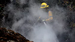 A Los Angeles firefighter hits hotspots.