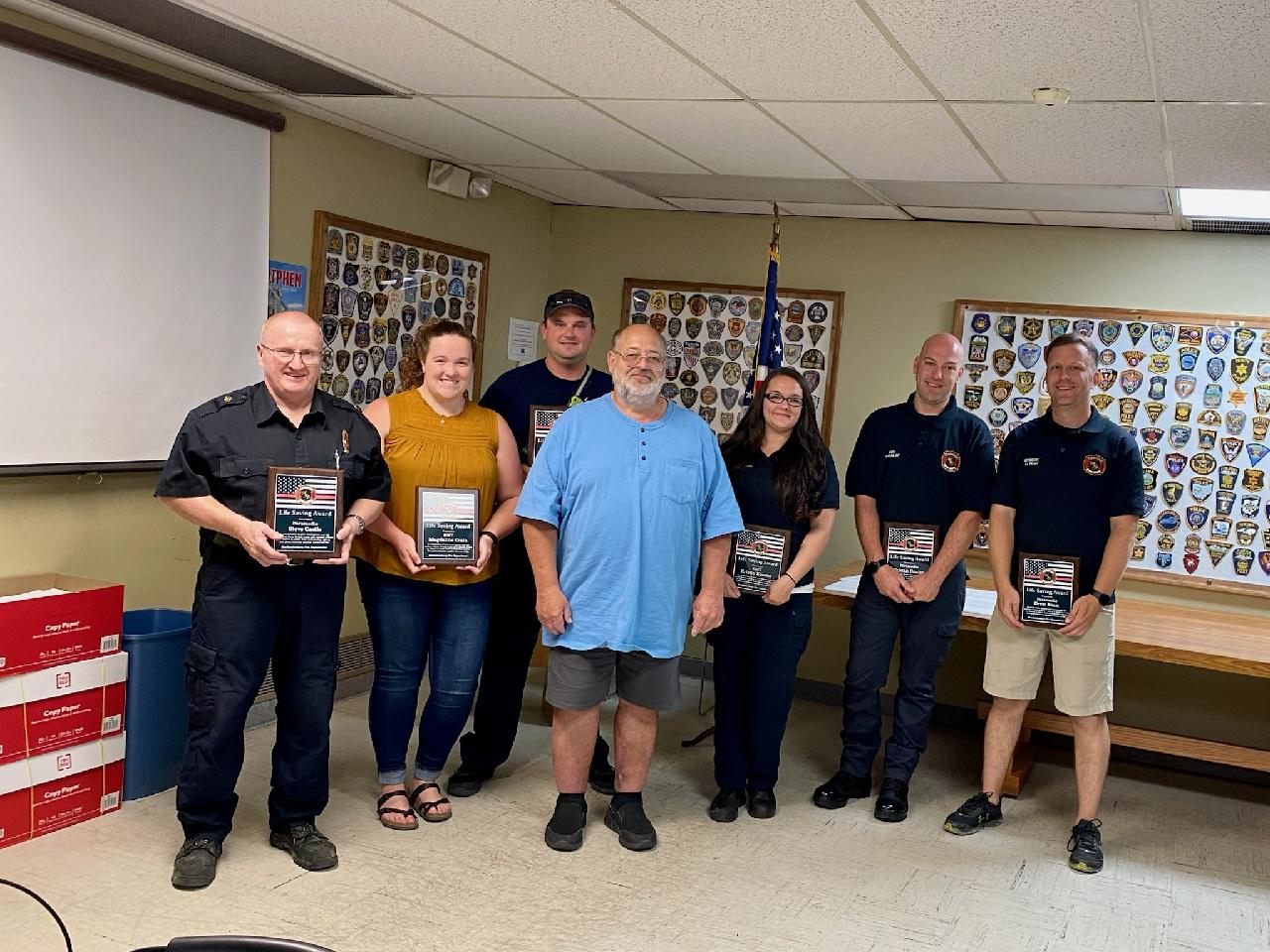 (From left) Assistant Fire Chief/Paramedic/EMS Coordinator Steve Castle, MFD EMT Magdalin Crain, Fire Chief/EMT Matt Bebout, John Donnersbach (patient), MFD EMT Kristen Koester, MFD Paramedic Tristian Dunlap, MFD Paramedic Drew Ream