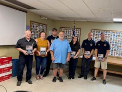 (From left) Assistant Fire Chief/Paramedic/EMS Coordinator Steve Castle, MFD EMT Magdalin Crain, Fire Chief/EMT Matt Bebout, John Donnersbach (patient), MFD EMT Kristen Koester, MFD Paramedic Tristian Dunlap, MFD Paramedic Drew Ream (From left) Assistant Fire Chief/Paramedic/EMS Coordinator Steve Castle, MFD EMT Magdalin Crain, Fire Chief/EMT Matt Bebout, John Donnersbach (patient), MFD EMT Kristen Koester, MFD Paramedic Tristian Dunlap, MFD Paramedic Drew Ream