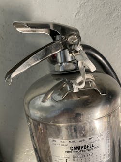 You can use almost anything to maintain the pin on a water can. Here, an elastic strap from a nonrebreather mask is used. You also can use paracord and coil tethers. You can use almost anything to maintain the pin on a water can. Here, an elastic strap from a nonrebreather mask is used. You also can use paracord and coil tethers.