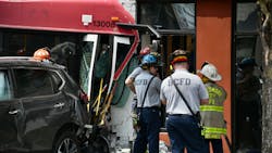 Firefighters at the scene of a multi-vehicle crash that involved an MTA bus and two other cars in Baltimore Saturday.