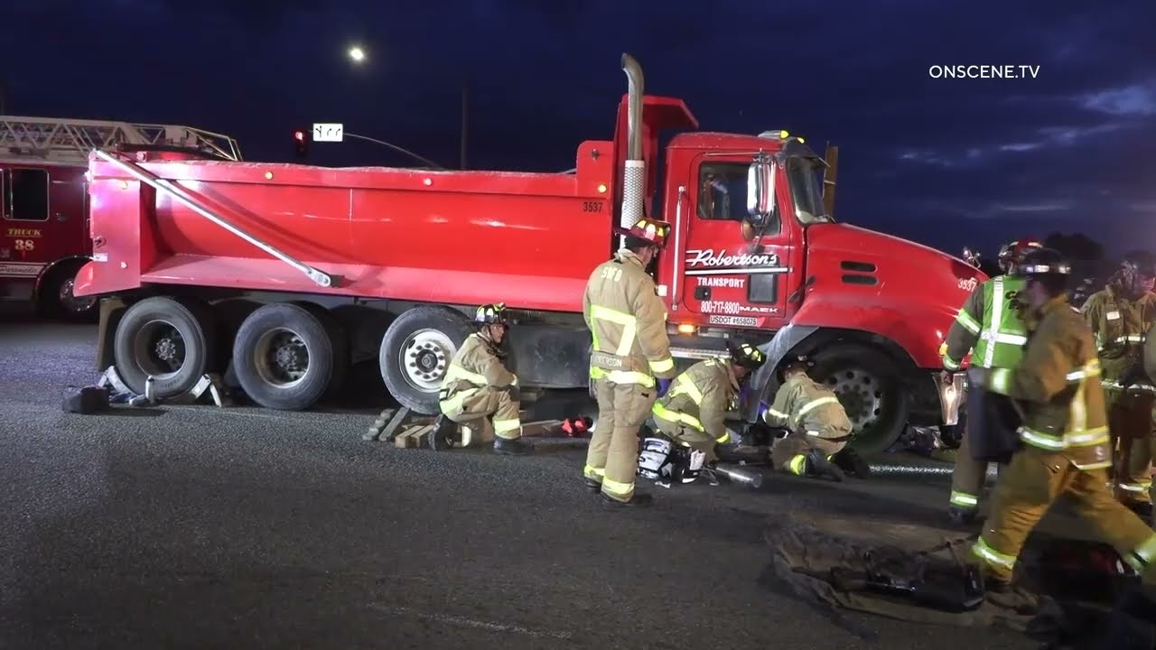 Bicyclist Trapped under Dump Truck Rescued by CA Firefighters | Firehouse