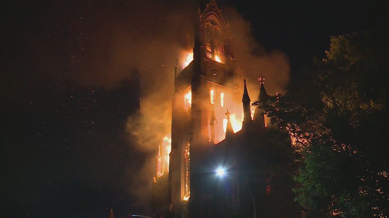 A four-alarm fire late Wednesday engulfed a towering historic church that had been converted into an indoor skatepark north of downtown St. Louis.