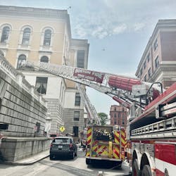 Several trucks started extending their ladders towards upper-story windows of the State House. Several trucks started extending their ladders towards upper-story windows of the State House.