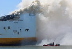 Smoke pours from the Grande Costa D'Avorio cargo ship Thursday afternoon, hours after two Newark firefighters died while battling a fire reported Wednesday night. Smoke pours from the Grande Costa D'Avorio cargo ship Thursday afternoon, hours after two Newark firefighters died while battling a fire reported Wednesday night.