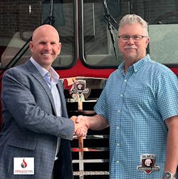 Dinges Fire Company Chief Executive Officer Nick Dinges shakes hands with HME Ahrens-Fox Vice President, Sales, Dave Rider. Dinges Fire Company Chief Executive Officer Nick Dinges shakes hands with HME Ahrens-Fox Vice President, Sales, Dave Rider.