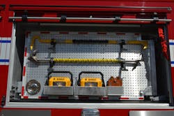 This swing-out tool board utilizes both off-the-shelf and custom brackets. Pegboard allows future mounting changes without the need to drill. Note the use of a standard D-ring latch to lock the tool board in place. This swing-out tool board utilizes both off-the-shelf and custom brackets. Pegboard allows future mounting changes without the need to drill. Note the use of a standard D-ring latch to lock the tool board in place.