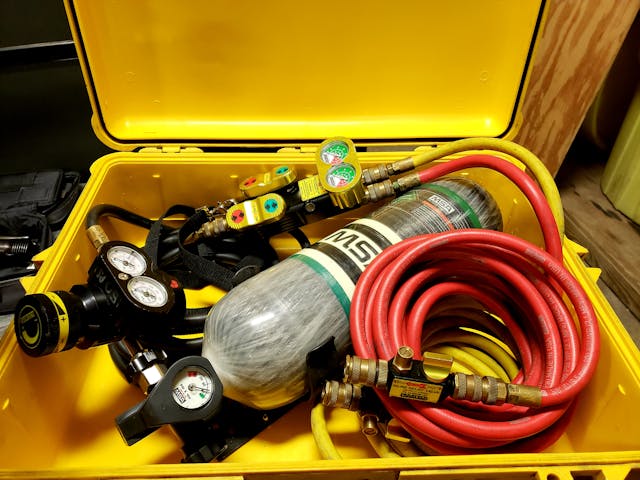 A large Pelican case that has an SCBA bracket mounted inside of it provides the means for quick deployment of an airbag.