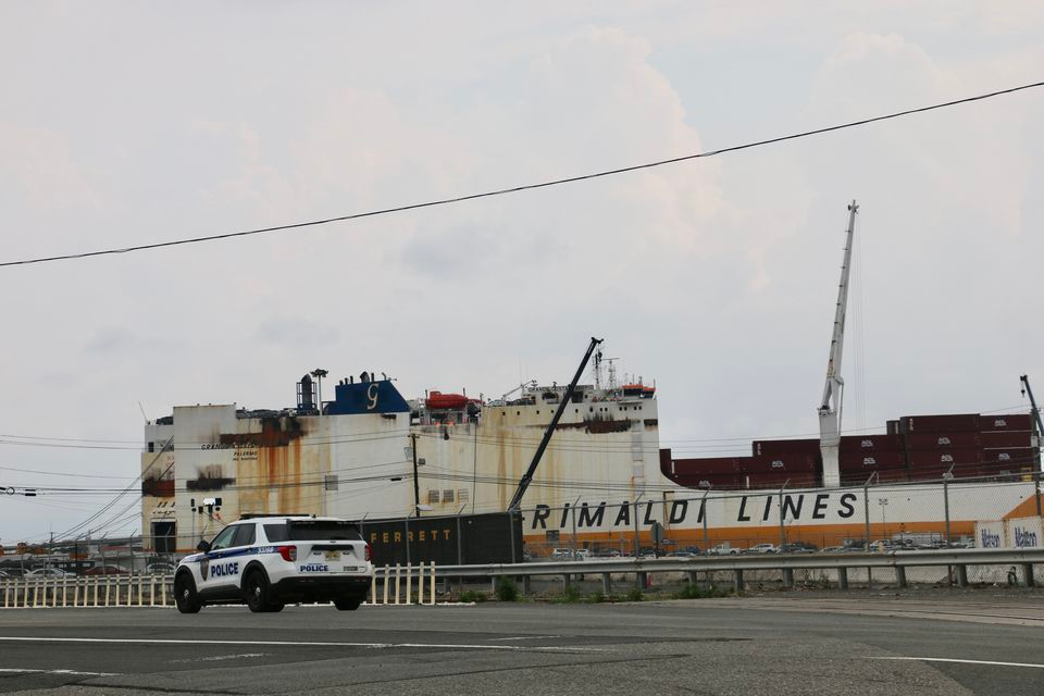 The fire aboard the ship where two Newark, NJ were killed was declared out Tuesday.