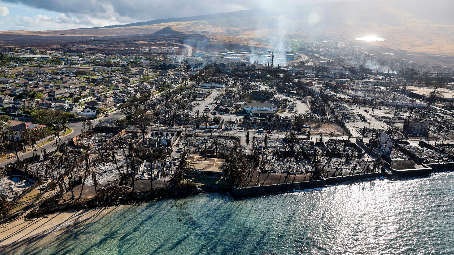 Days after the wildfire spread through Lahaina, buildings still smolder.
