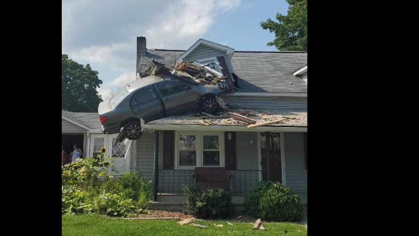 The car veered off the road, crossed a pasture field, hit an embankment and went airborne, landing on the porch roof of a Decatur Township home.