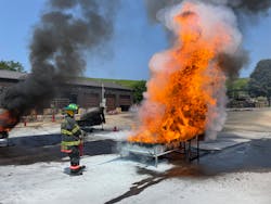 The students practiced using fire extinguishers on wood on pallets. The students practiced using fire extinguishers on wood on pallets.