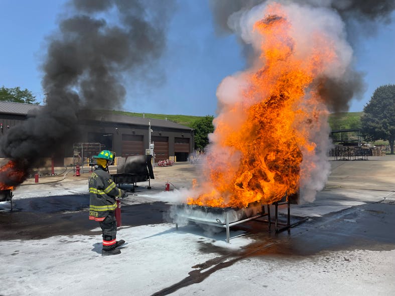 The students practiced using fire extinguishers on wood on pallets.