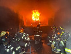 The 'Blue Team' stays low in the flashover simulator room. The 'Blue Team' stays low in the flashover simulator room.