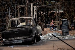 A resident reacts as she walks through the ruins of a a house destroyed by the Lahaina Fire, in Lahaina, in Maui, on Aug. 15, 2023. A resident reacts as she walks through the ruins of a a house destroyed by the Lahaina Fire, in Lahaina, in Maui, on Aug. 15, 2023.