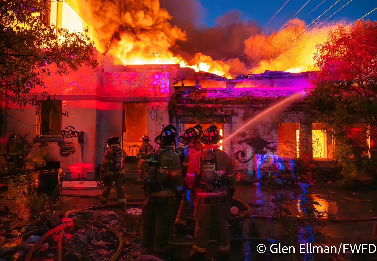 Fort Worth firefighters battle the first of two fires at the former R. Vickery School Tuesday night.