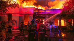 Fort Worth firefighters battle the first of two fires at the former R. Vickery School Tuesday night.