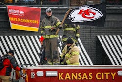 A firefighter waves a flag atop an engine during the 2020 Super Bowl parade. A firefighter waves a flag atop an engine during the 2020 Super Bowl parade.