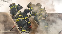 In the process of carrying out a Milwaukee cut, a firefighter on each of two roof ladders starts by cutting an approximately four-foot vertical seam that runs parallel to each ladder beam that’s closest to the hole location. In the process of carrying out a Milwaukee cut, a firefighter on each of two roof ladders starts by cutting an approximately four-foot vertical seam that runs parallel to each ladder beam that’s closest to the hole location.