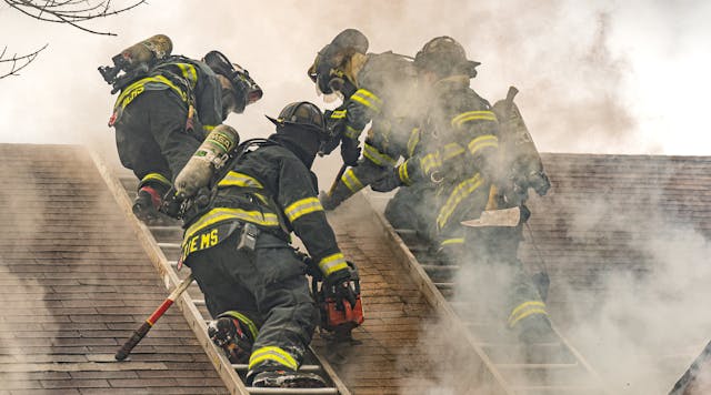 In the process of carrying out a Milwaukee cut, a firefighter on each of two roof ladders starts by cutting an approximately four-foot vertical seam that runs parallel to each ladder beam that&rsquo;s closest to the hole location.