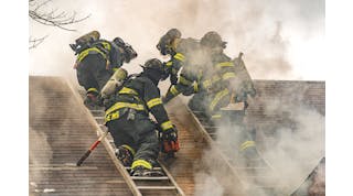 In the process of carrying out a Milwaukee cut, a firefighter on each of two roof ladders starts by cutting an approximately four-foot vertical seam that runs parallel to each ladder beam that&rsquo;s closest to the hole location.