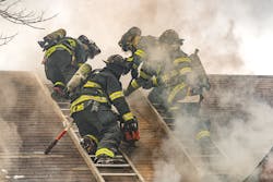 In the process of carrying out a Milwaukee cut, a firefighter on each of two roof ladders starts by cutting an approximately four-foot vertical seam that runs parallel to each ladder beam that’s closest to the hole location. In the process of carrying out a Milwaukee cut, a firefighter on each of two roof ladders starts by cutting an approximately four-foot vertical seam that runs parallel to each ladder beam that’s closest to the hole location.
