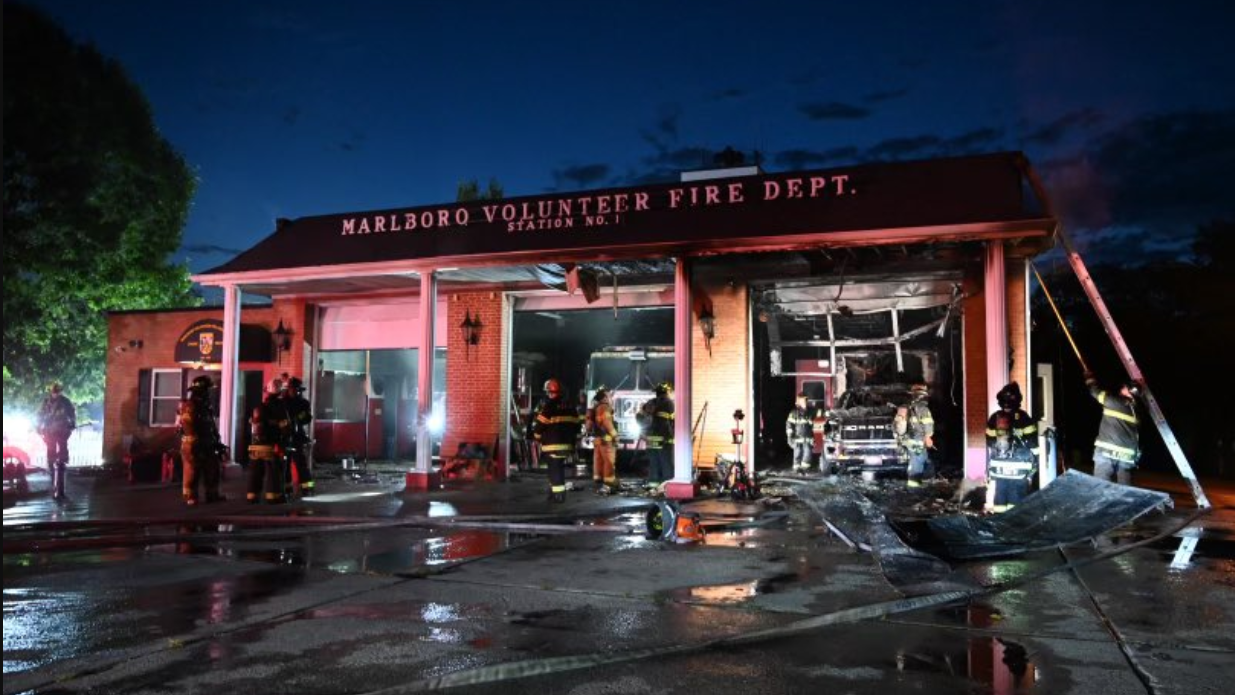 Firefighters look over the aftermath of a fire that is believed to have started in an ambulance and burned through the roof of the Prince George&rsquo;s County Fire/EMS Department station in Upper Marlboro.