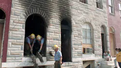 Fire investigators work at the scene where six children died in 1992. Fire investigators work at the scene where six children died in 1992.