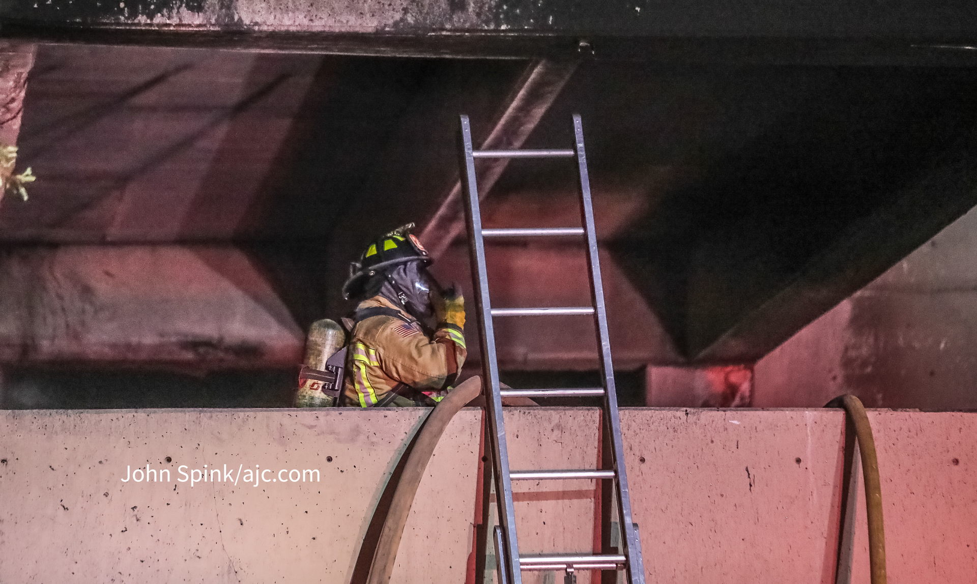 An Atlanta firefighter working at a parking deck fire.