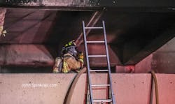 An Atlanta firefighter working at a parking deck fire. An Atlanta firefighter working at a parking deck fire.