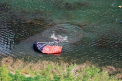 A BASE jumper deployed the pilot chute too late, which resulted in the main chute deploying too close to the ground. The jumper was unable to steer the chute to the landing zone on shore and ended up in the water. Although this jumper was uninjured and continued jumping that day, it isn’t uncommon for a jumper who is in this situation to be injured or, possibly, even drown. A BASE jumper deployed the pilot chute too late, which resulted in the main chute deploying too close to the ground. The jumper was unable to steer the chute to the landing zone on shore and ended up in the water. Although this jumper was uninjured and continued jumping that day, it isn’t uncommon for a jumper who is in this situation to be injured or, possibly, even drown.