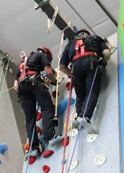 The rope rescue teams in Twin Falls have stringent membership requirements. Here, firefighters train at a local climbing gym.