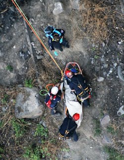SORT team members and TFFD firefighters package a patient and prepare to lower the person to the bottom of the Snake River Canyon.