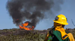 A wildland firefighter gives a report about a California wildfire.