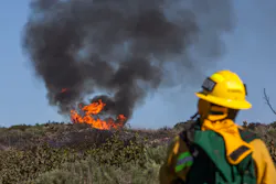A wildland firefighter gives a report about a California wildfire.