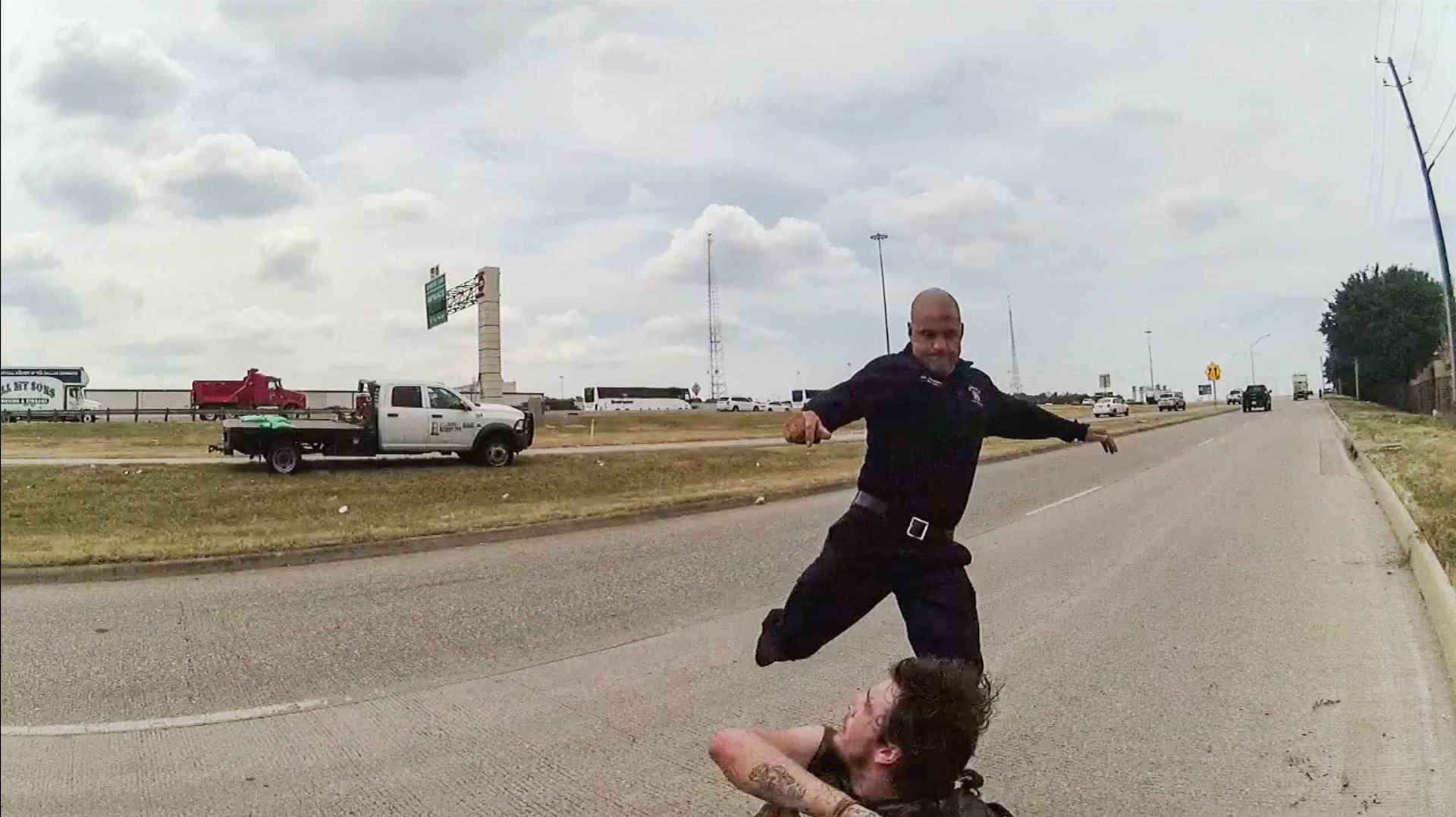 A police body cam captured Dallas Paramedic Brad Cox kicking and punching a homeless man.