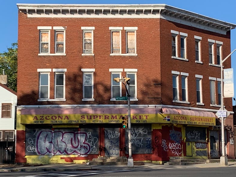 Taxpayers can have mixed occupancies in the same building. Note the windows on the second floor; follow-up is required to see whether this is being renovated or repaired.