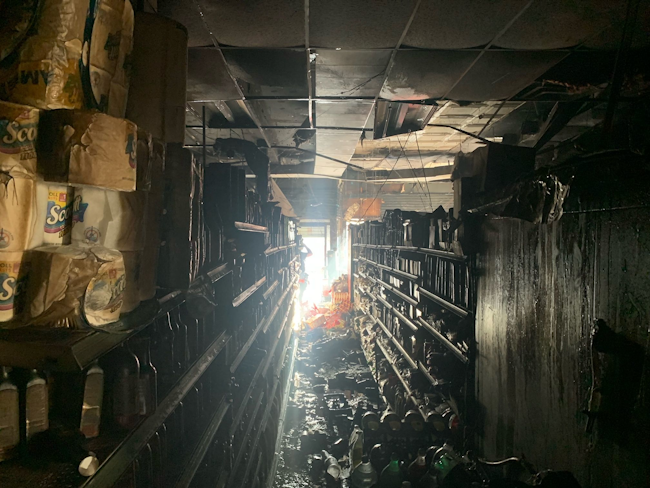 Lateral and vertical spread are concerns in these types of occupancies. Note the tin ceiling that’s installed above the drop-tile ceiling in this store.