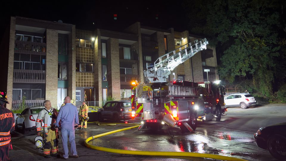Syracuse firefighters rescued two people from an apartment fire.