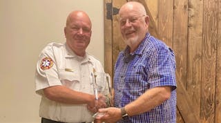 Division Chief of Prevention Jason Turner, Jefferson City Fire Department (l.) nominated Kyle Kittrell for the Bringing Safety Home Award.