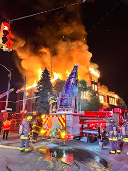 Firefighters battle a fire at a vacant school