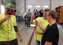 High School student Trevor Early (center) shows Cody Black (right) how to tie a knot while Gabe Finley of the Grangeville Mountain Rescue Unit looks on. Early was working on his senior project, which is to support the Grangeville Mountain Rescue Unit. High School student Trevor Early (center) shows Cody Black (right) how to tie a knot while Gabe Finley of the Grangeville Mountain Rescue Unit looks on. Early was working on his senior project, which is to support the Grangeville Mountain Rescue Unit.