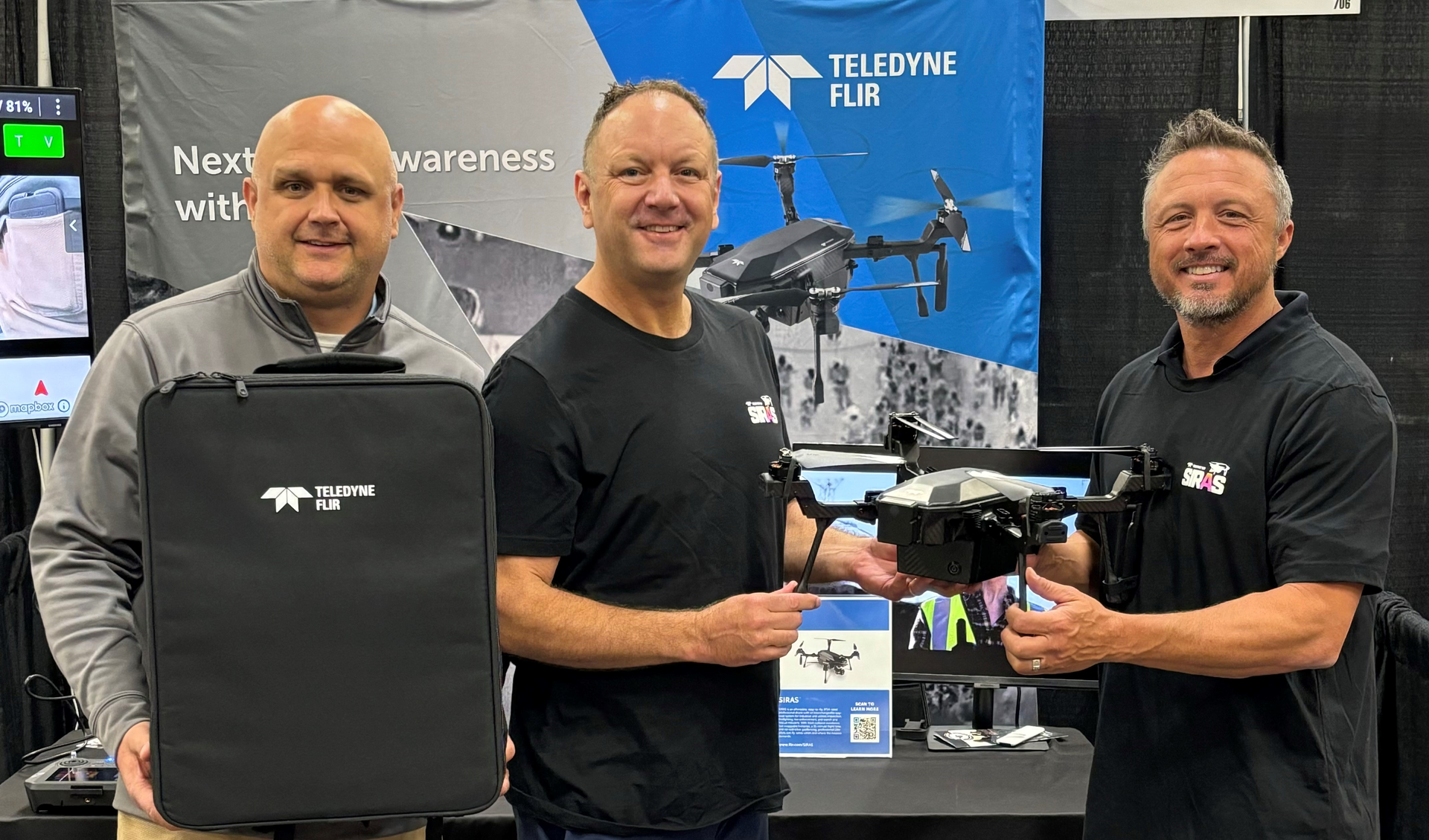 Firehouse Vice President/Publisher Bill MacRae (l.) and Teledyne Director Greg Nagler (c.) present the SIRAS to Joey Dockins, who accepted the award on behalf of winner Jerod Davenport.