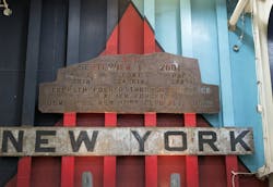 A piece of rusted steel from the Work Trade Center, hangs over the ramp on the USS New York. A piece of rusted steel from the Work Trade Center, hangs over the ramp on the USS New York.