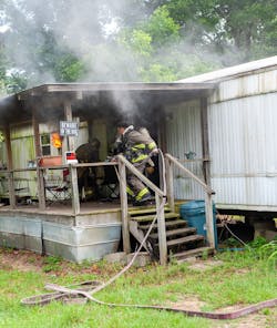A smaller fire that still is an interior contents fire usually can be extinguished with the 150 gpm/2.5 gallons per second (gps) from a 1¾-inch attack line. Here, the chief arrived first and assisted to ensure that there was no delay in getting the line inside. Arrival determines the task. A smaller fire that still is an interior contents fire usually can be extinguished with the 150 gpm/2.5 gallons per second (gps) from a 1¾-inch attack line. Here, the chief arrived first and assisted to ensure that there was no delay in getting the line inside. Arrival determines the task.